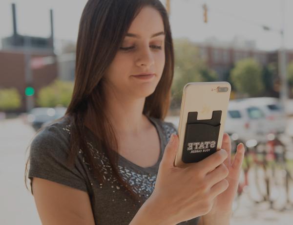 Student checking her grades on her smartphone